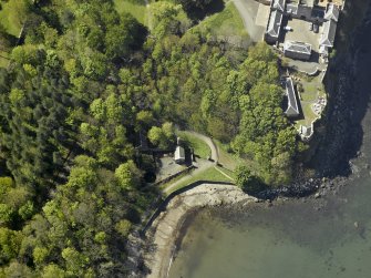 Oblique aerial view centred on the gas house with the stable block adjacent, taken from the NE.