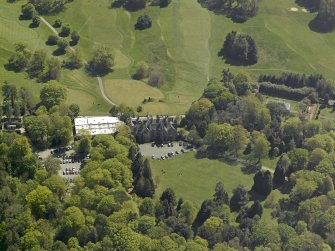 Oblique aerial view of Belleisle House with the walled garden and greenhouse adjacent, taken from the NW.