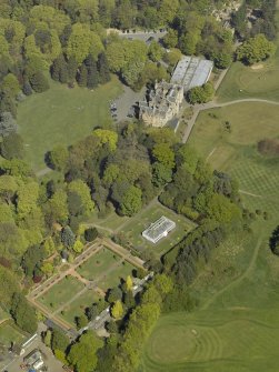 Oblique aerial view of Belleisle House with the walled garden and greenhouse adjacent, taken from the S.