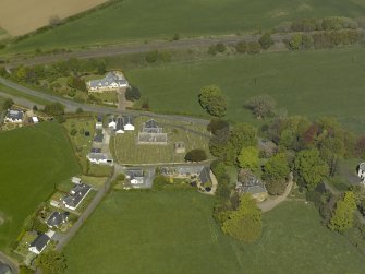 Oblique aerial view centred on the Church with the manse adjacent, taken from the SSE.