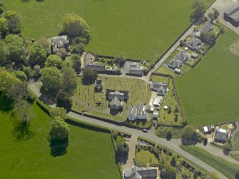 Oblique aerial view centred on the Church with the manse adjacent, taken from the NNW.