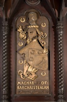 Interior. Choir, detail of coat of arms (Macnab of Barchaistealan) on back of stall