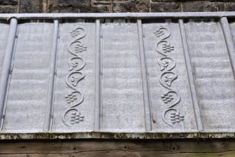 Cloister, detail of embossed decoration on lead roof