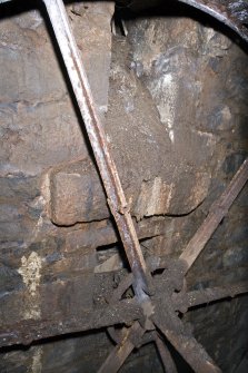 Interior. View of axle as it enters adjacent building (NE range).
