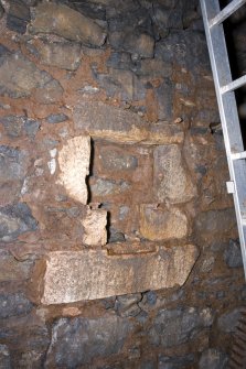 Interior. View of blocked opening in exterior wall of NE range at the tail race end of the pit.