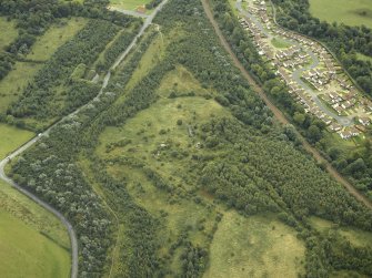 Oblique aerial view centred on the remains of an anti-aircraft battery, taken from the NNW.