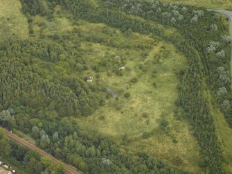 Oblique aerial view centred on the remains of an anti-aircraft battery, taken from the SW.