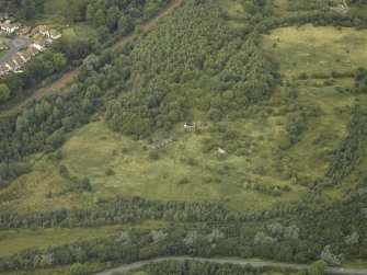 Oblique aerial view centred on the remains of an anti-aircraft battery, taken from the E.