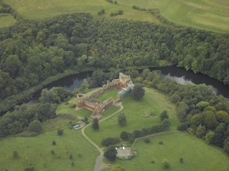 Oblique aerial view centred on the castle, taken from the NE.