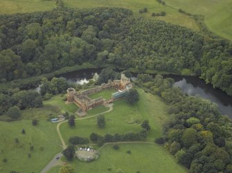 Oblique aerial view centred on the castle, taken from the NNE.