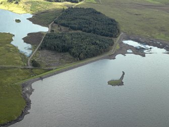 Oblique aerial view centred on E dam with reservoir adjacent, taken from the NW.