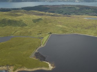 Oblique aerial view centred on W dam with reservoir adjacent, taken from the SE.
