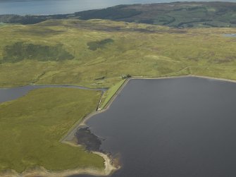 Oblique aerial view centred on W dam with reservoir adjacent, taken from the E.