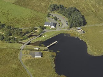 Oblique aerial view centred on the dam and sluice with bridge adjacent, taken from the NE.