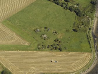 Oblique aerial view centred on the anti-aircraft battery with the remains of the farmstead adjacent, taken from the W.