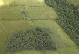 Oblique aerial view centred on the decoy site control bunker, taken from the WSW.