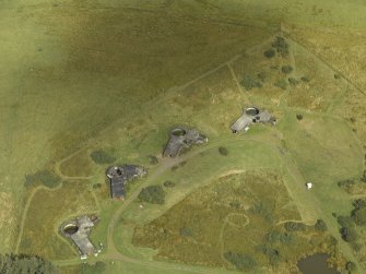 Oblique aerial view centred on postwar anti-aircraft battery gun emplacements, taken from the WSW.
