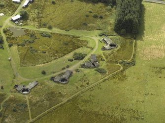 Oblique aerial view centred on postwar anti-aircraft battery gun emplacements, taken from the NE.
