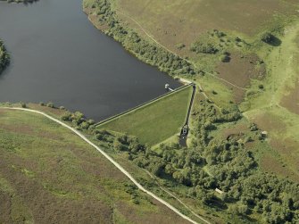 Oblique aerial view centred on the reservoir dam, taken from the SE.