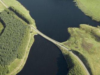 Oblique aerial view centred on the reservoir causeway, taken from the NNW.