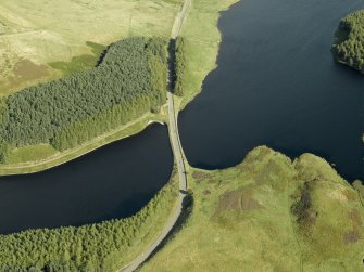 Oblique aerial view centred on the reservoir causeway, taken from the W.