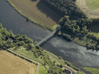 Oblique aerial view centred on the chain bridge with the fishing shiel adjacent, taken from the NE.