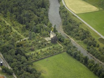 Oblique aerial view centred on the castle and garden with the suspension bridge adjacent, taken from the ESE.