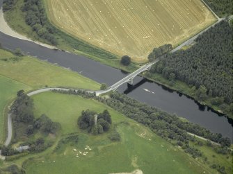 Oblique aerial view centred on the bridge with the remains of the tower adjacent, taken from the E.