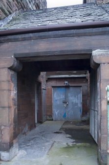 Entrance and covered porch. View from SE