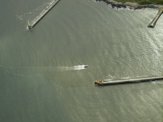 Oblique aerial view centred on the North pier and South breakwaters, taken from the NW.