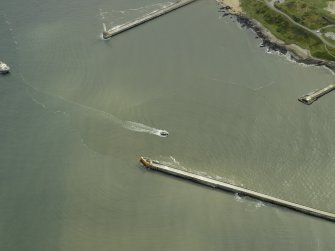 Oblique aerial view centred on the North pier and South breakwaters, taken from the NW.