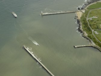 Oblique aerial view centred on the North pier and South breakwaters, taken from the WNW.