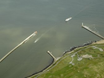 Oblique aerial view centred on the North pier and South breakwaters, taken from the SW.