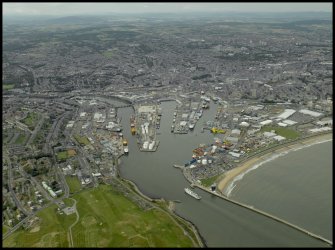 General oblique aerial view centred on the harbour, taken from the ESE.