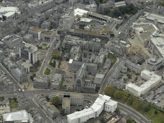 Oblique aerial view of the city centre centred on Marischal College, taken from the NE.
