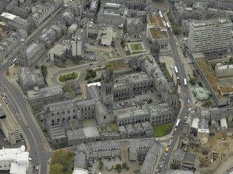 Oblique aerial view of the city centre centred on Marischal College, taken from the NW.