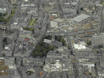 Oblique aerial view of the city centre centred on the Church of St Nicholas and Market Street, taken from the SE.