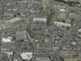 Oblique aerial view of the city centre centred on Marischal College, taken from the SE.