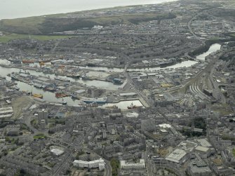 General oblique aerial view of the city centre centred on Guild Street station, taken from the NW.