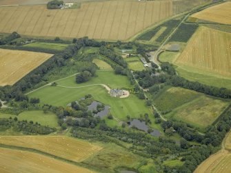 Oblique aerial view centred on Menie House, taken from the S.