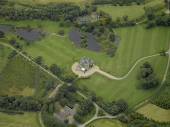 Oblique aerial view centred on Menie House, taken from the NE.