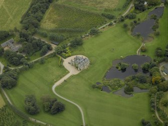 Oblique aerial view centred on Menie House, taken from the NW.