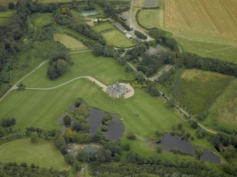 Oblique aerial view centred on Menie House, taken from the SSW.