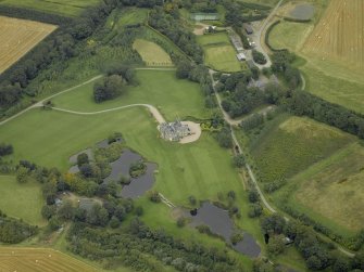 Oblique aerial view centred on Menie House, taken from the SSE.