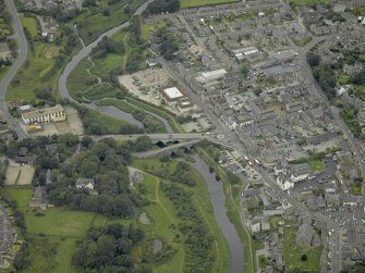 Oblique aerial view centred on the old and new bridges, taken from the E.