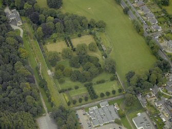 Oblique aerial view centred on the remains of Ellon Castle and walled garden, taken from the WNW.