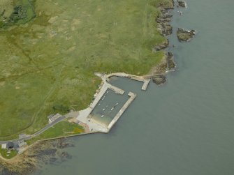 Oblique aerial view centred on the harbour, taken from the NW.