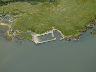 Oblique aerial view centred on the harbour, taken from the W.