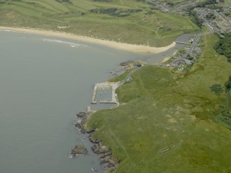 General oblique aerial view centred on the harbour with Port Errol adjacent, taken from the SE.