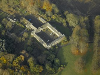 Oblique aerial view centred on the stable block, taken from the SE.